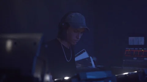 Close-up handheld shot of DJ playing music on turntable Stock Footage 114876668