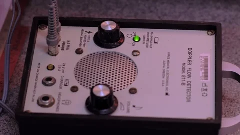Close-up handheld shot of a Doppler flow detector device with knobs and a 스톡 동영상 320100361