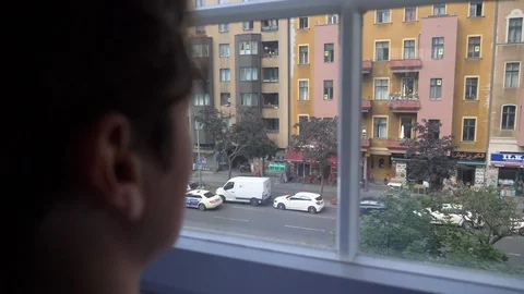 Close-up handheld shot of man looking through window Vídeo Stock 114871678