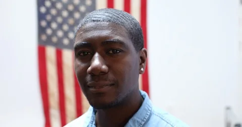 Close-up handheld shot of man smiling at camera Video stock 119726033