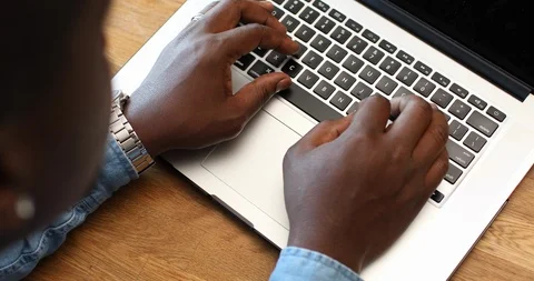 Close-up handheld shot of man using laptop in kitchen Stock Footage 119795291