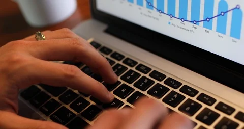 Close-up handheld shot of mans hand typing while using on laptop over table Stock Footage 119936589