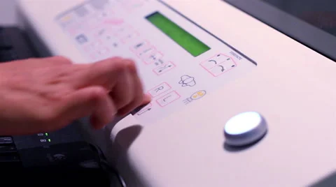 CLOSE UP-HANDHELD SHOT. Nurses hands operating the mastography scan machine. Stock Footage 48200081