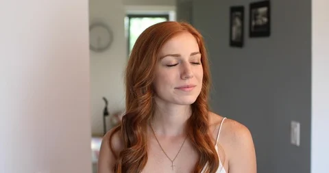 Close-up handheld shot of redhead young woman smiling Stock Footage 119748924