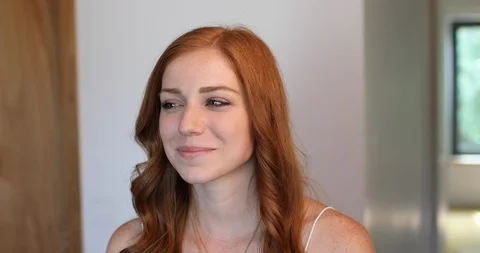 Close-up handheld shot of redhead young woman smiling Stock Footage 119758085