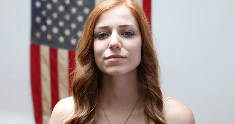 Close-up handheld shot of redhead young woman smiling at camera Stock Footage 119793440