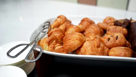 Close Up Handheld Shot of Self-Serve Breakfast Pastries with Croissants and.. Video stock 341701196