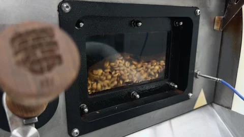 Close Up Handheld Shot through Industrial Coffee Roaster Sight Glass Window.. 스톡 동영상 332155570