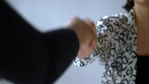 Close-up handheld shot of two shaking hands in office meeting 스톡 동영상 114871369