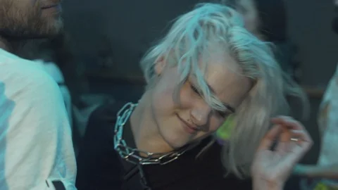 Close-up handheld shot of young couple dancing face to face in nightclub Stock Footage 114877685
