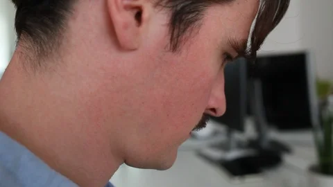 Close-up handheld shot of young man working at office Vídeo Stock 120431684