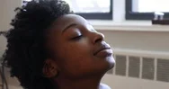 Close-Up Handheld Shot Of Young Woman With Closed Eyes During Exercise Stock Footage
