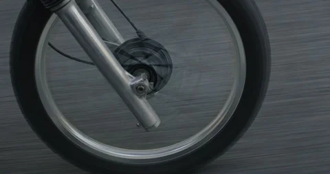 Close up handheld slow motion shot of caucasian man riding motorbike in Japan Stock Footage 124720629