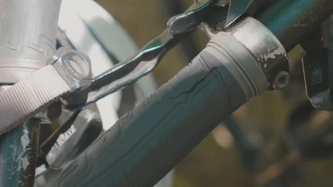 Close up of a handle bar and brake on a bicycle in the dappled shade Stock Footage 88765041