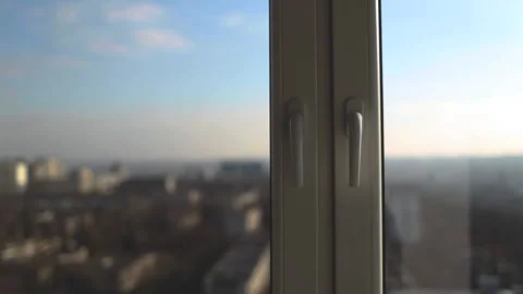 Close-up of handle of plastic windows in sunny day on background of blue sky. Vidéo 201425188