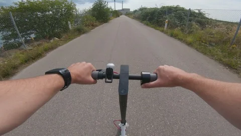 Close up of handlebar on electric scooter while riding on road Stock Footage 116204282