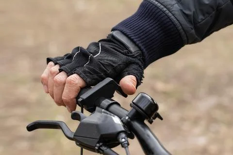 Close-up of the handlebars of an electric bicycle.Throttle button on the e-.. Stock Photos
