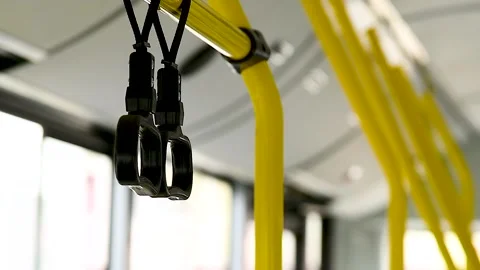 Close-up of the handles for a standing passenger inside the bus Stock Footage 306547078
