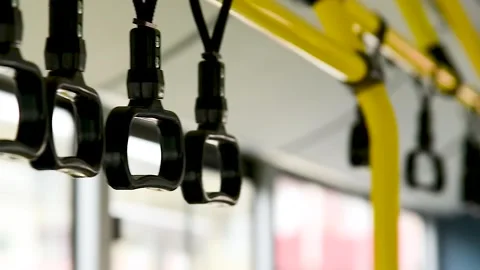 Close-up of the handles for a standing passenger inside the bus Stock Footage 306547094