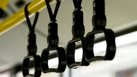 Close-up of the handles for a standing passenger inside the bus Stock Footage 320998114