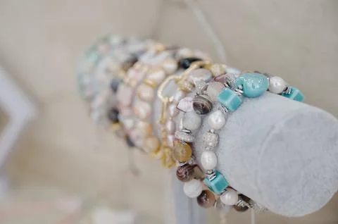 Close-up of handmade bracelets made of agate, pearls and rhinestones Stock Photos