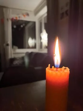 Close up of handmade burning beeswax sheet candle decorated for Christmas i.. Stock Photos