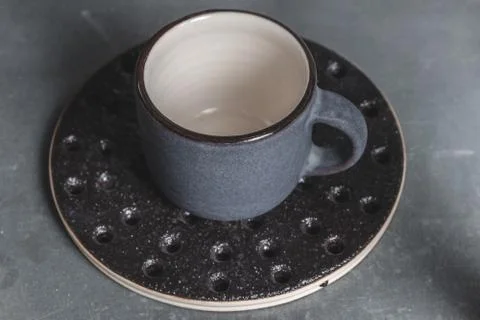 Close-up handmade ceramic cup with substrate made from white clay in the pott Stock Photos