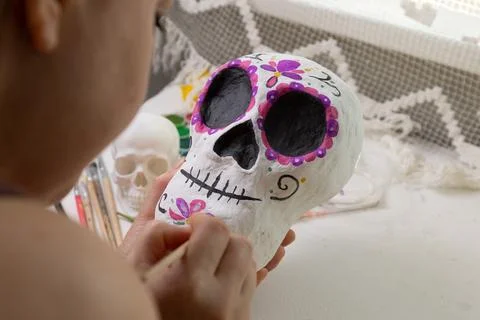 Close-up of a handmade Dia de los Muertos skull sculpture in progress at an i Stock Photos