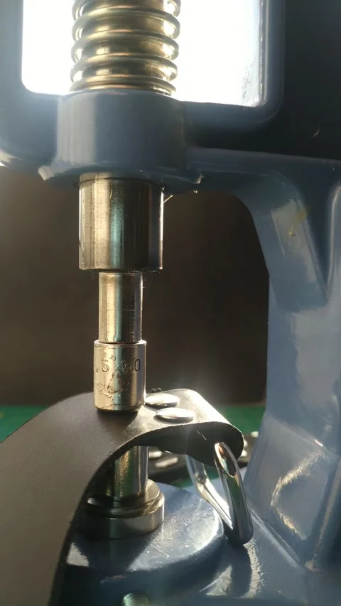 Close-up, handmade to install rivets on the skin, with a manual machine. Slow Stock Footage 229813077