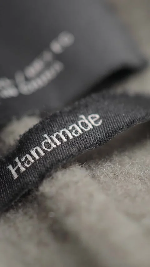 Close-up of a handmade label on fabric Stock Footage 341068790