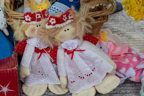 Close Up of Handmade Pair of Fabric Rag Dolls with Flower Headbands Stock Photos