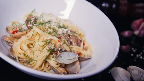 Close-up of handmade pasta with fresh herbs and seafood. Stock Footage 112652880