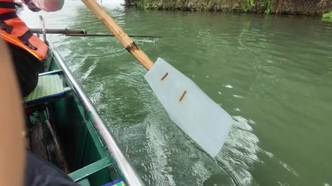 Close-Up of Handmade Wooden Oar Rowing on Boat in Ninh Binh River, Vietnam Stock Footage 330406077