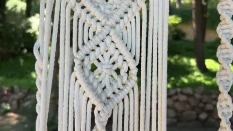 Close up handmade woven cotton macrame decor Stock Footage 245880116