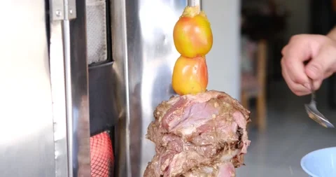 Close up of hands adding fats and oil on kebab meat while cooking on grill 스톡 동영상 151470413