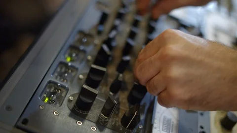 Close-up of hands adjusting compressor and equalizer. Professional recording Stock Footage 116018464