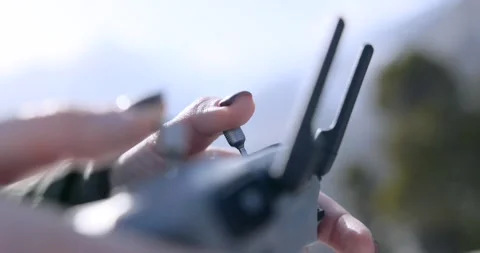 Close Up Hands Adjusting Portable Drone Controller Knob Stock-Footage 343927653