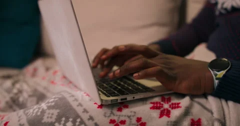 Close-up of hands of African-looking guy typing on laptop keyboard. The guy Stock Footage 211214332