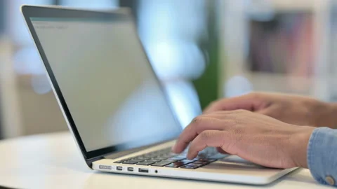 Close Up of Hands of African Man Typing on Laptop Keypad Stock Footage 146484535