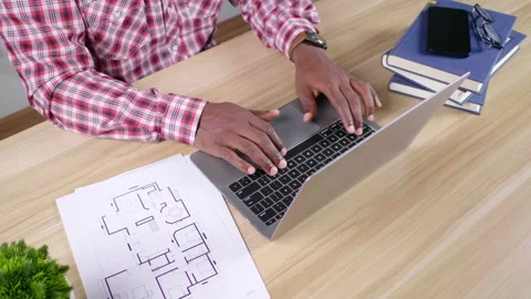 Close up hands African Man working with laptop and document on table at home Video stock 165438225