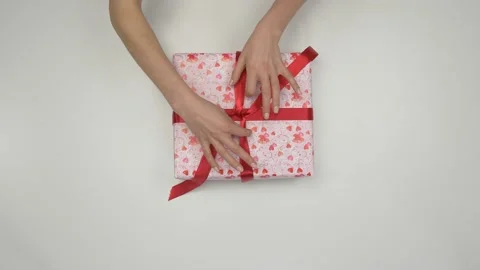Close-up of the Hands and the Gift. Holidays and Gifts. Stock Footage 176343479