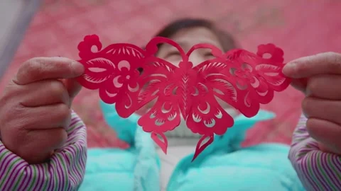 Close up of hands and the process of Paper Cuttings. Stock Footage 256133093