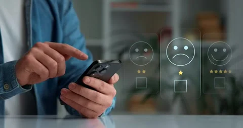 Close-up of hands and smartphone, evaluation of the quality of service,store Stock Footage 274205796