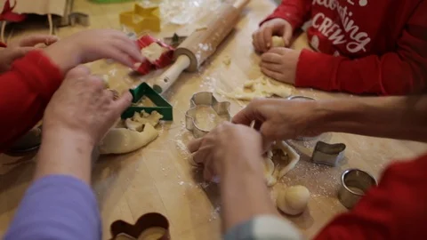 Close Up Hands Around a Table Making Cookies Stock Footage 94084778