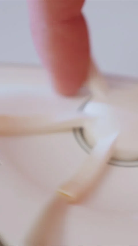 Close up of hands assembling small white plastic electronic components showing Stock Footage 346787048