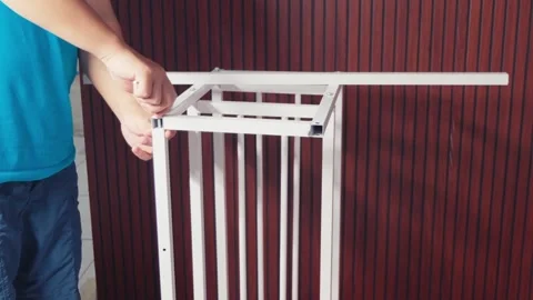 Close-up of Hands Assembling White Metal Shelf Frame, DIY Furniture Installation Stock Footage 333316760