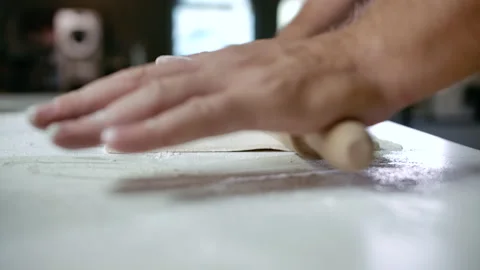 Close-up Hands of Bakery Chef Using Wooden Rolling Pin on Dough for Pizza Slowmo Stock Footage 142787124