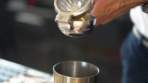 Close up of hands of bartender who squeezing lemon juice in metal hand juicer Stock Footage 312564759