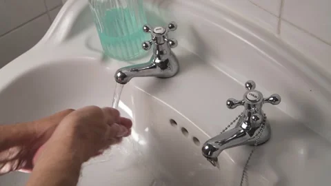 Close-Up of Hands Being Washed in Basin, Hygiene and Cleaning Concept Stock Footage 319898507