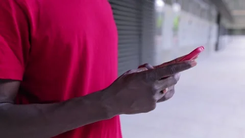 Close-up hands of black man using smartphone outdoors Stock Footage 161675953